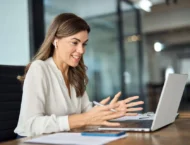 career woman with headphone on computer