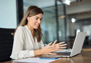 career woman with headphone on computer